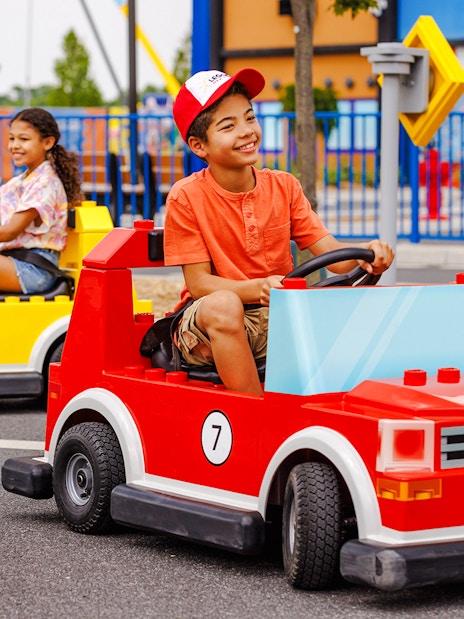 Children driving Lego cars at Legoland New York.