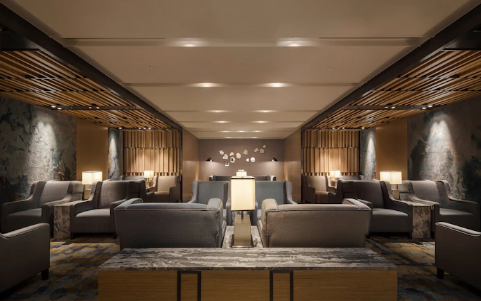 Seating area in Plaza Premium Lounge, Zone C, Taipei, Taiwan with modern decor and ambient lighting.