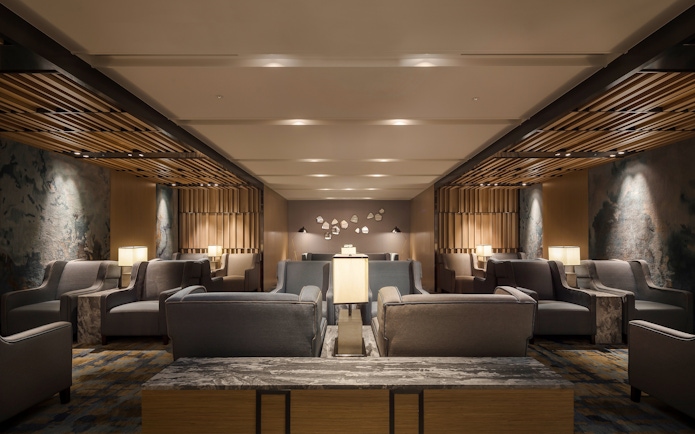 Seating area in Plaza Premium Lounge, Zone C, Taipei, Taiwan with modern decor and ambient lighting.