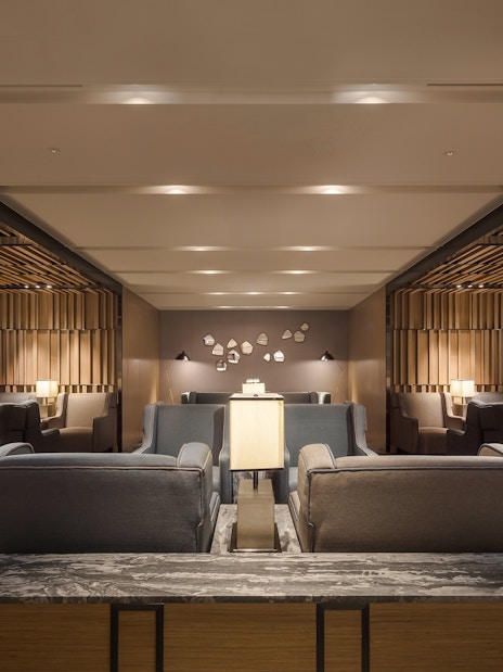 Seating area in Plaza Premium Lounge, Zone C, Taipei, Taiwan with modern decor and ambient lighting.