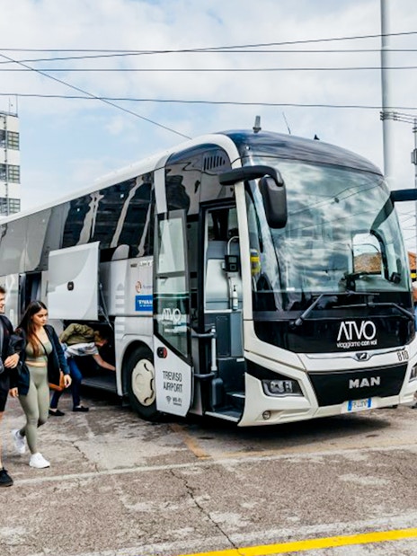 Passengers boarding ATVO airport transfer bus in Venice.
