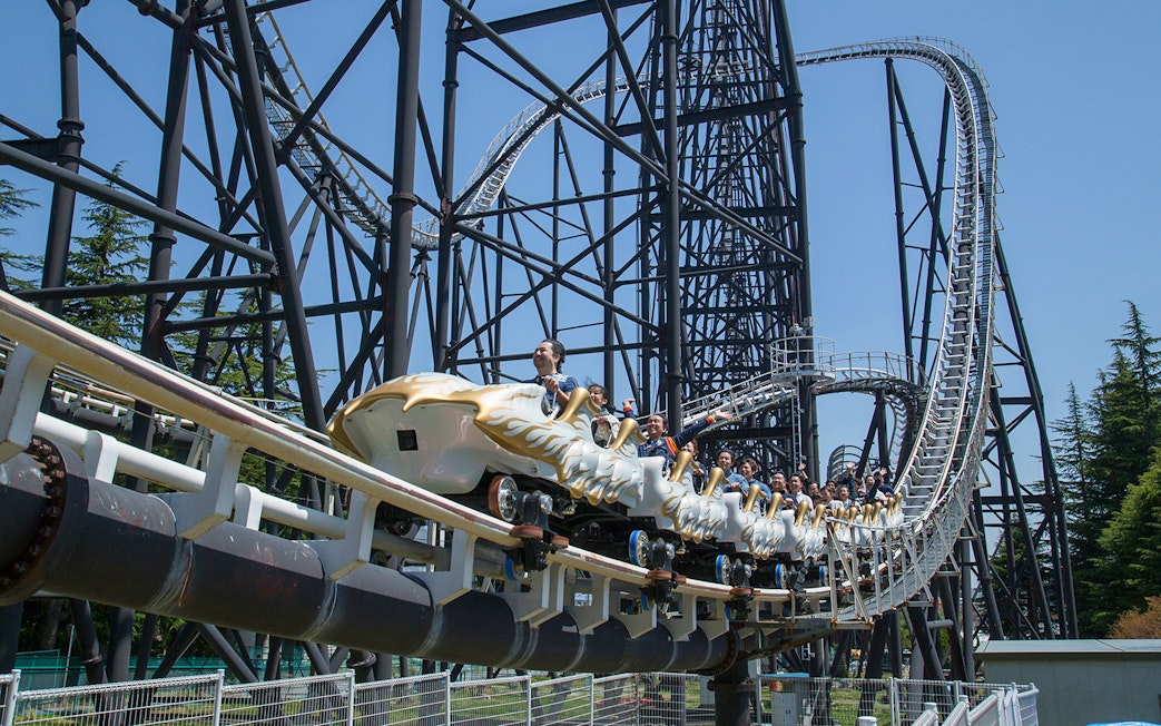 Rollercoaster riders at Fuji-Q Highland, Japan, on a thrilling descent.