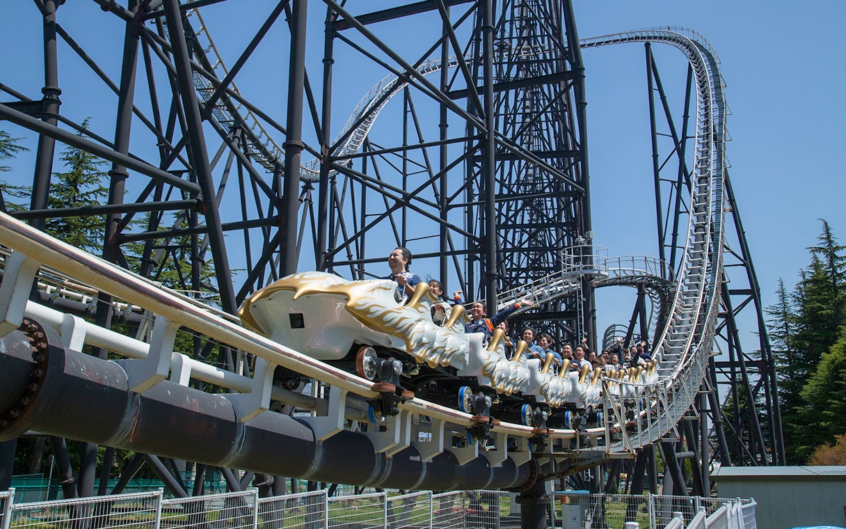 Rollercoaster riders at Fuji-Q Highland, Japan, on a thrilling descent.