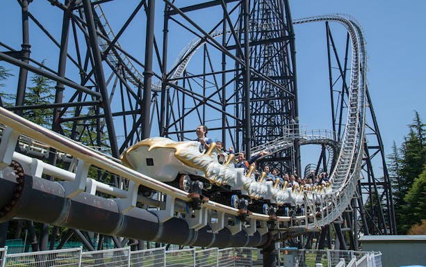 Rollercoaster riders at Fuji-Q Highland, Japan, on a thrilling descent.