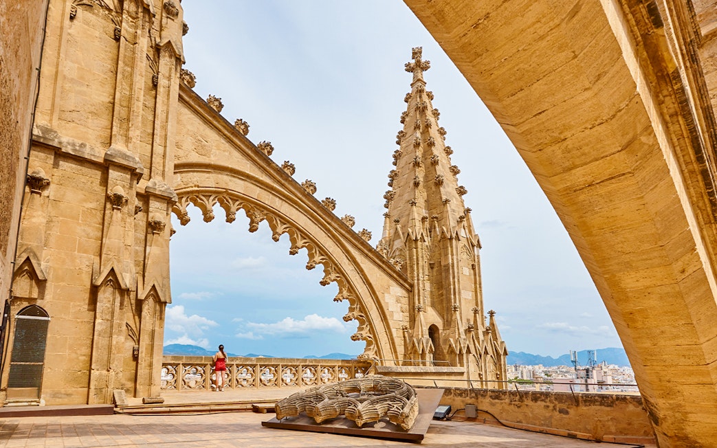 Palma de Mallorca cathedral rooftop with arches and pinnacles, Balearic Islands.
