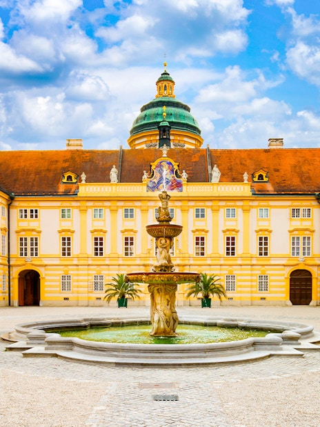 Melk Abbey courtyard with fountain, Danube Valley day trip from Vienna.