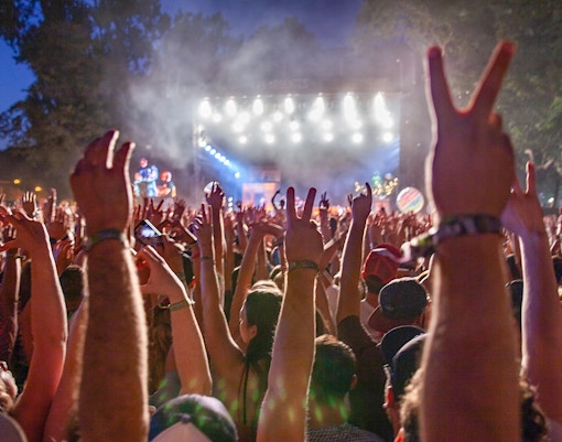 Crowd enjoying SummerStage music concert at Central Park, New York in June.