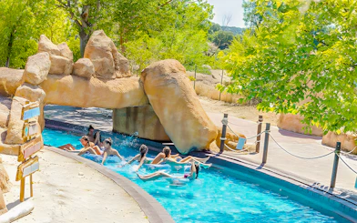 Visitors enjoying the lazy river at Aquopolis Villanueva de la Cañada.