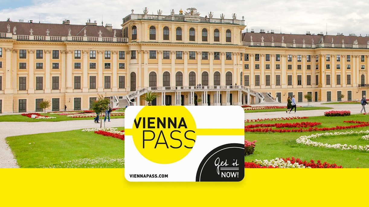 Vienna Pass card in front of Schönbrunn Palace, Vienna, with gardens and visitors.