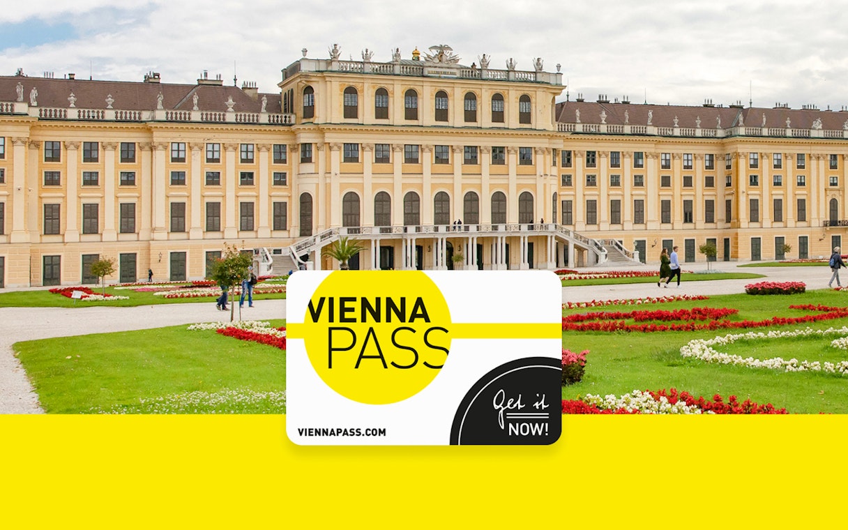 Vienna Pass card in front of Schönbrunn Palace, Vienna, with gardens and visitors.