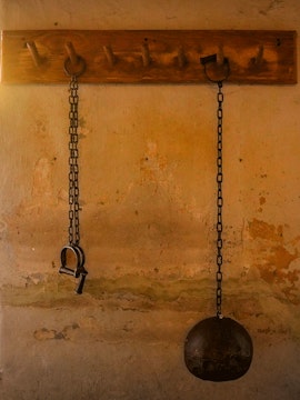 Chains and shackles on a wall at the Medieval Torture Museum.
