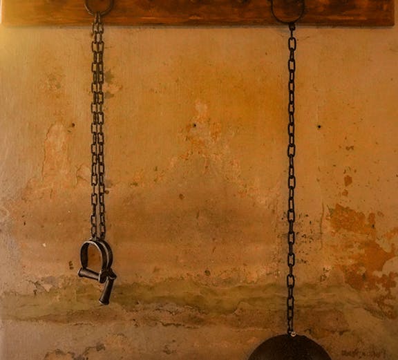 Chains and shackles on a wall at the Medieval Torture Museum.