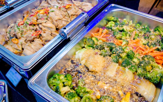 Buffet dishes with chicken and vegetables on Royal Princess Dinner Cruise, New Year's Eve Countdown 2027.