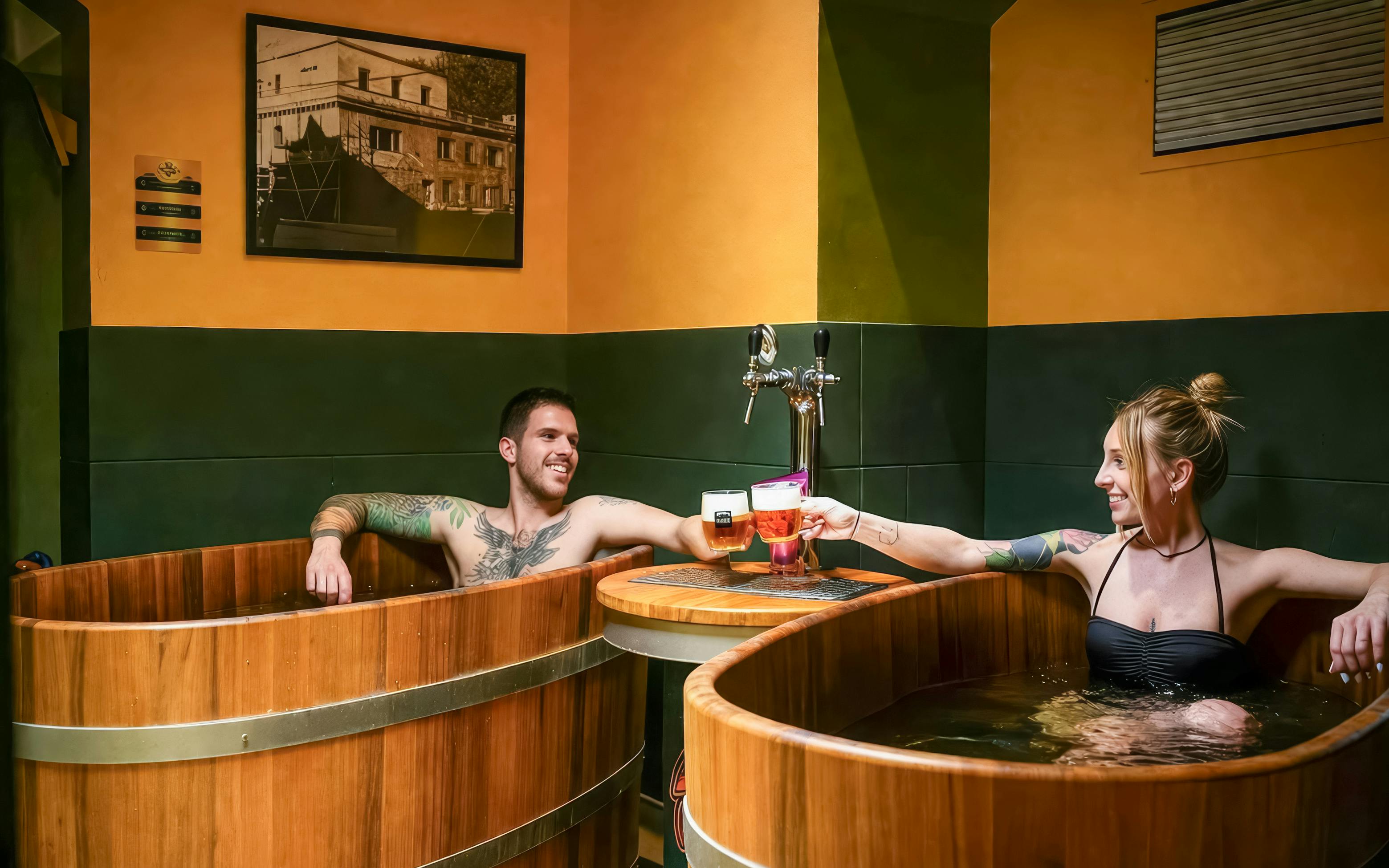 Couple enjoying beer spa in wooden tubs at Budapest's Lukács Thermal Bath.