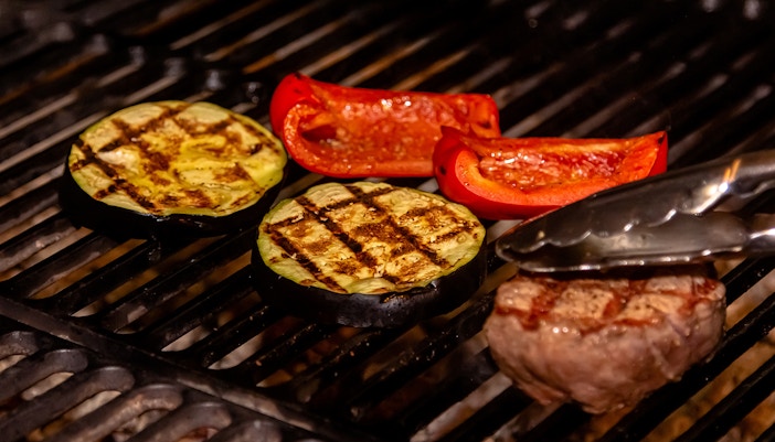 Beef, eggplant and sweet pepper are grilled on a charcoal grill