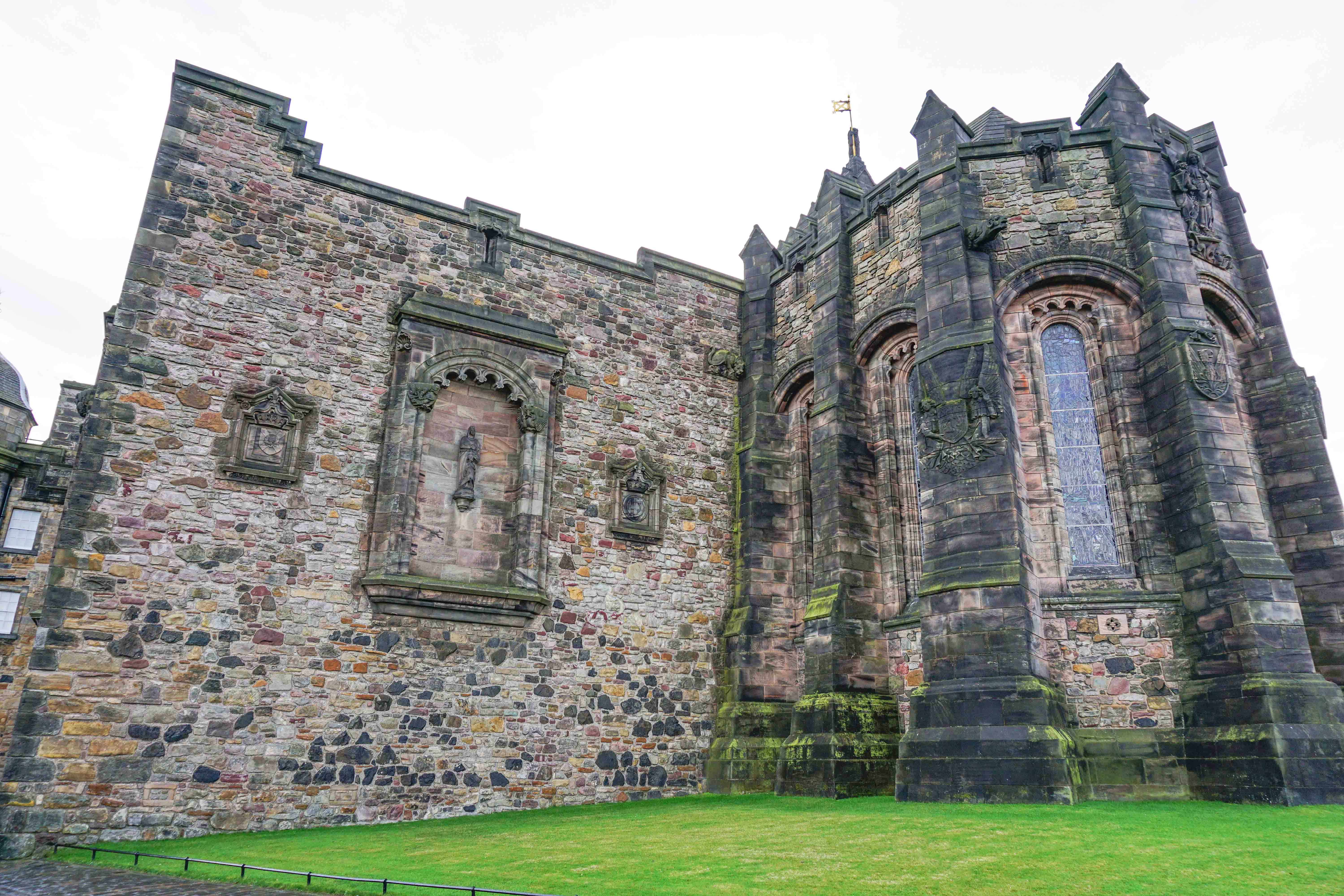 St. Margaret’s Chapel stone exterior with arched windows and historic carvings.