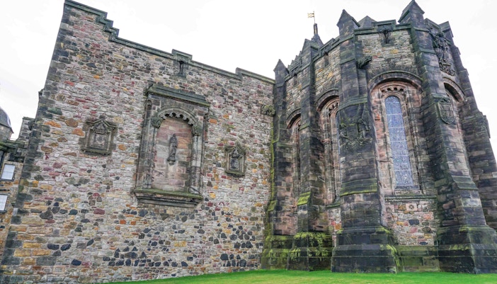 St. Margaret’s Chapel stone exterior with arched windows and historic carvings.