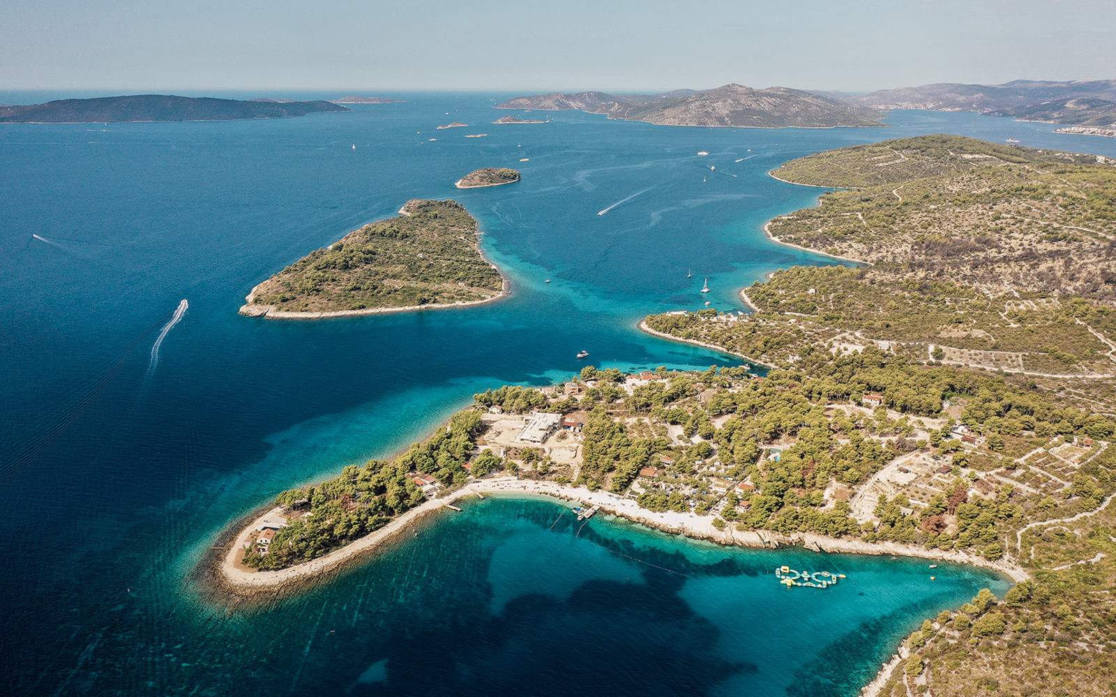 Aerial view of the Blue Lagoon with surrounding islands and clear blue waters.