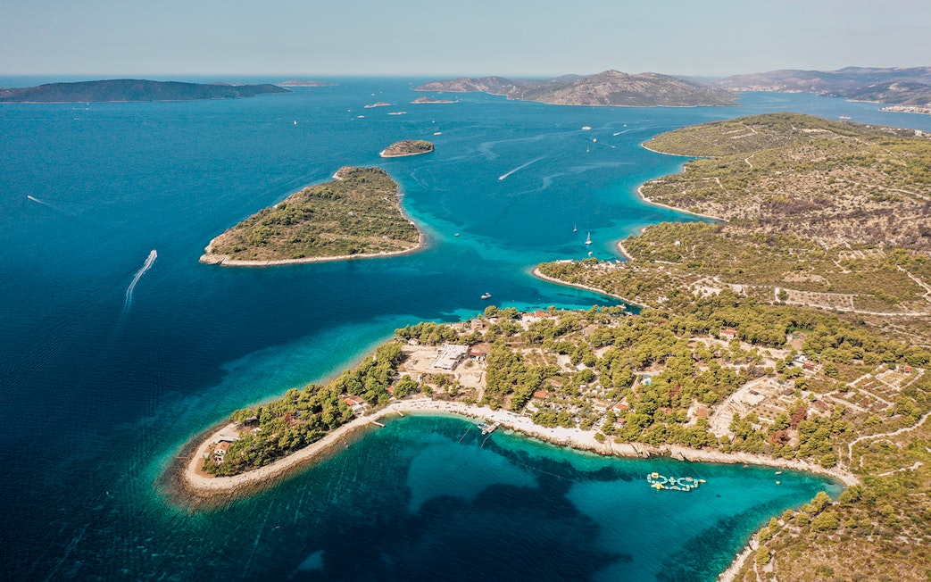 Aerial view of the Blue Lagoon with surrounding islands and clear blue waters.
