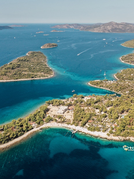 Aerial view of the Blue Lagoon with surrounding islands and clear blue waters.