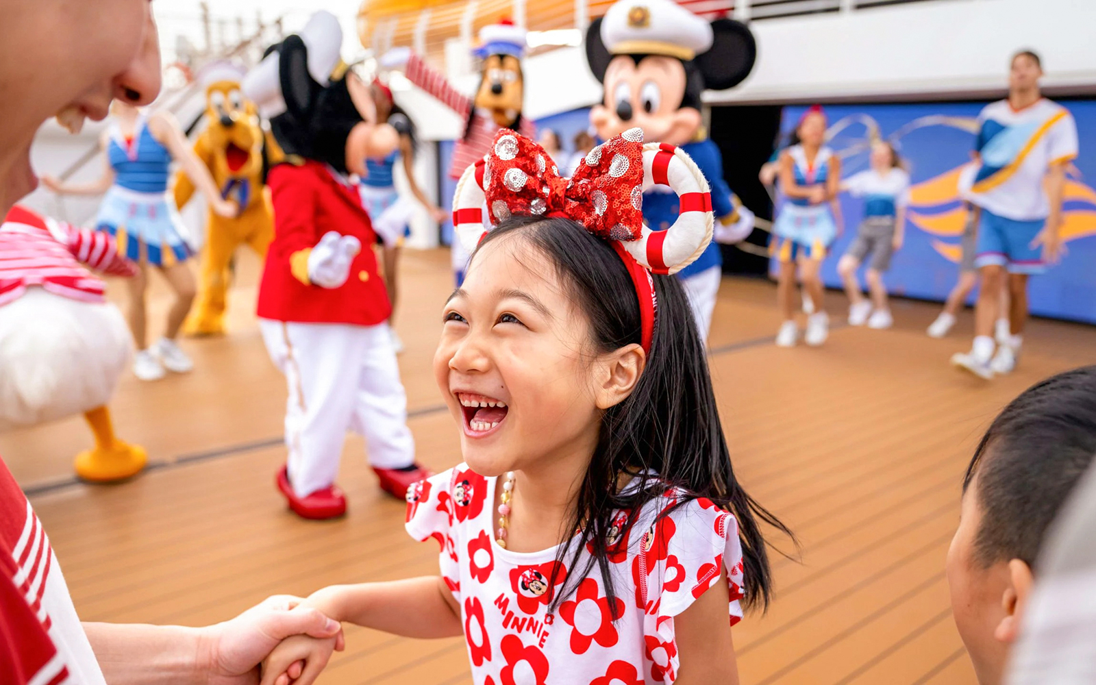 Child enjoying sail away party on Disney Adventure Cruise, Singapore.