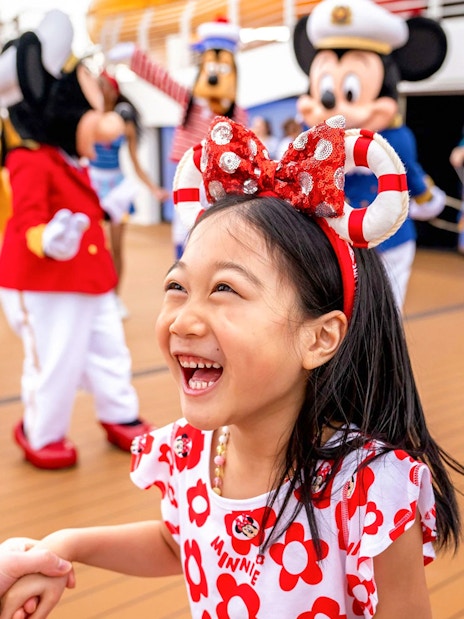 Child enjoying sail away party on Disney Adventure Cruise, Singapore.