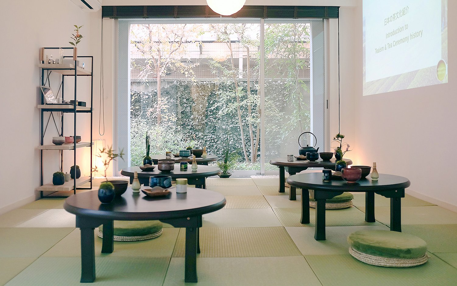 Tatami room setup for Tokyo Matcha & Kimono Experience with tea ceremony tables.