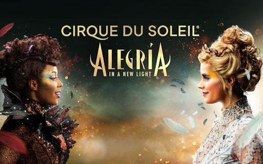 Cirque du Soleil Alegría performers facing each other with colorful makeup in Seville.