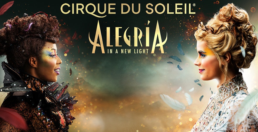 Cirque du Soleil Alegría performers facing each other with colorful makeup in Seville.