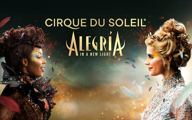 Cirque du Soleil Alegría performers facing each other with colorful makeup in Seville.