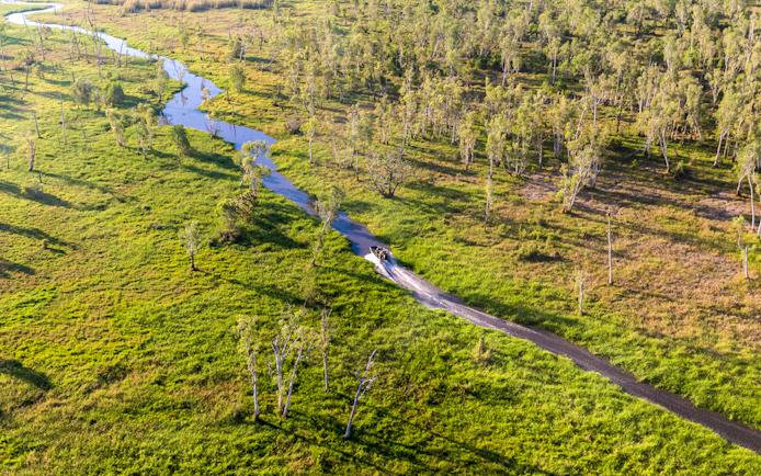Aerial view of a boat on Finniss River during Top End Safari Camp tour near Darwin.