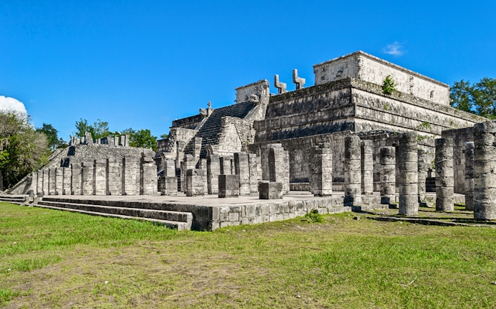 Temple of the Warriors at Chichen Itza, Yucatan, Mexico, with stone columns and steps.