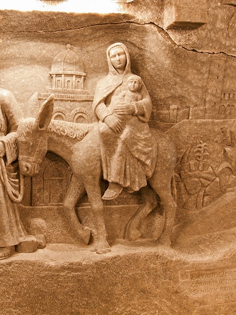 Wieliczka Salt Mine sculpture depicting biblical figures on a journey.