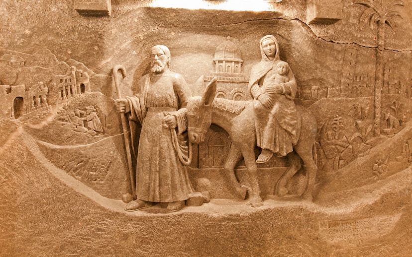 Wieliczka Salt Mine sculpture depicting biblical figures on a journey.