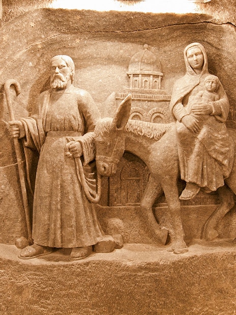 Wieliczka Salt Mine sculpture depicting biblical figures on a journey.