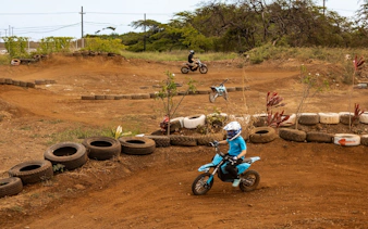Dirt bike riders on a track in Oahu with expert instruction.
