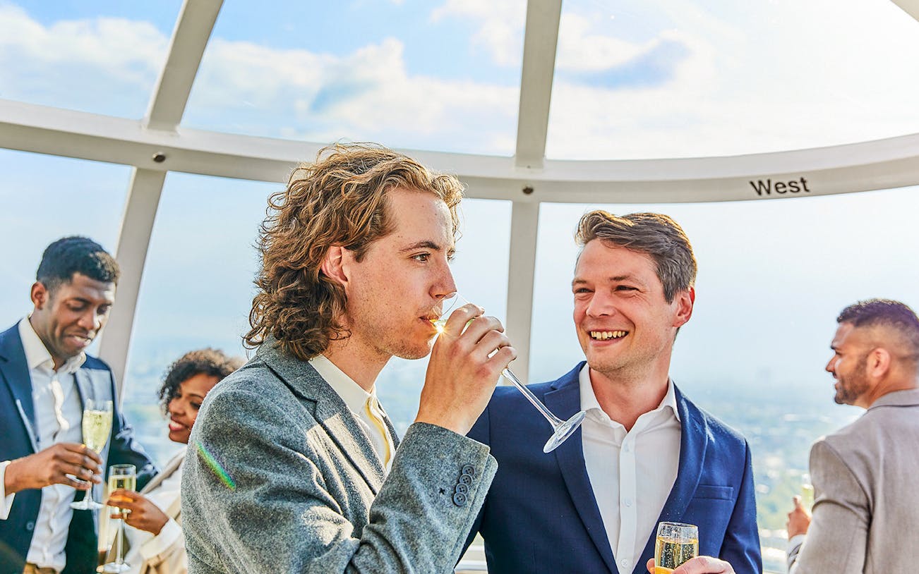 Guests enjoying champagne on the London Eye experience.