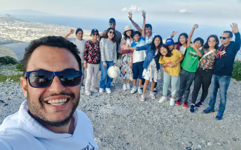 Group enjoying a scenic view during Santorini exploration tour.