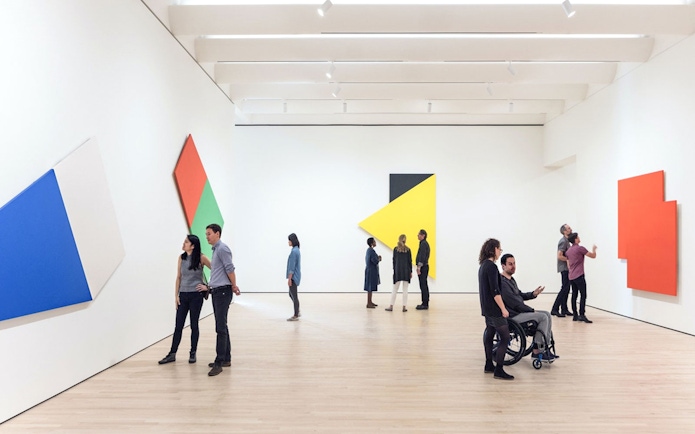 Guests viewing abstract art at Museum of Modern Art, San Francisco.