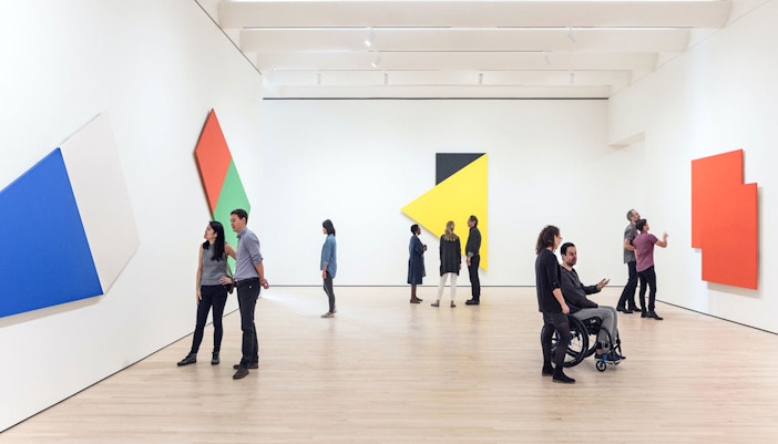 Visitor viewing art exhibit at San Francisco Museum of Modern Art.