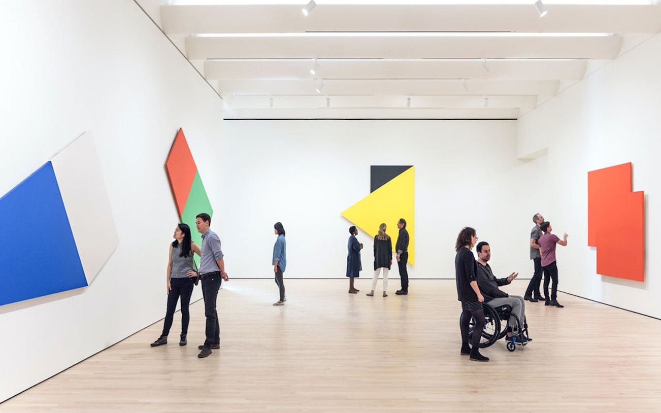 Guests viewing abstract art at Museum of Modern Art, San Francisco.