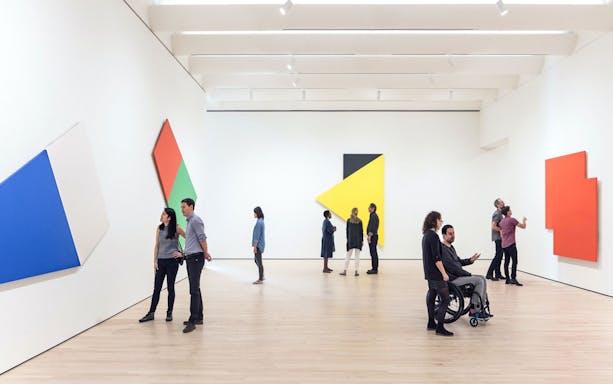Guests viewing abstract art at Museum of Modern Art, San Francisco.