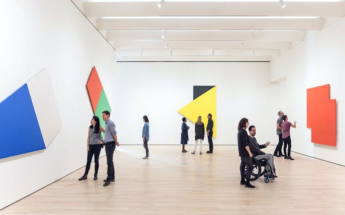 Guests viewing abstract art at Museum of Modern Art, San Francisco.