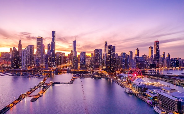 Chicago downtown skyline with Ferris wheel at sunset.