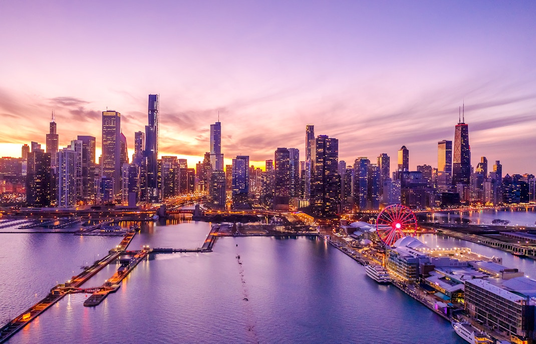 Chicago downtown skyline with Ferris wheel at sunset.