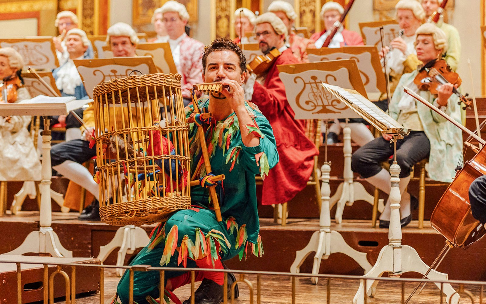 Musicians in period costumes performing at Vienna's Musikverein Golden Hall.