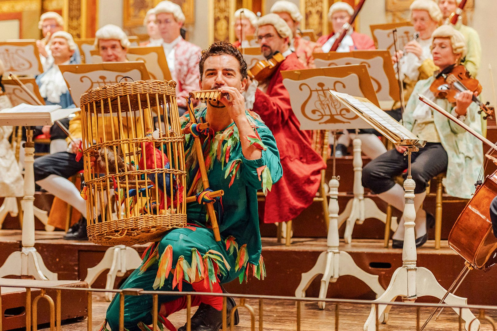 Musicians in period costumes performing at Vienna's Musikverein Golden Hall.