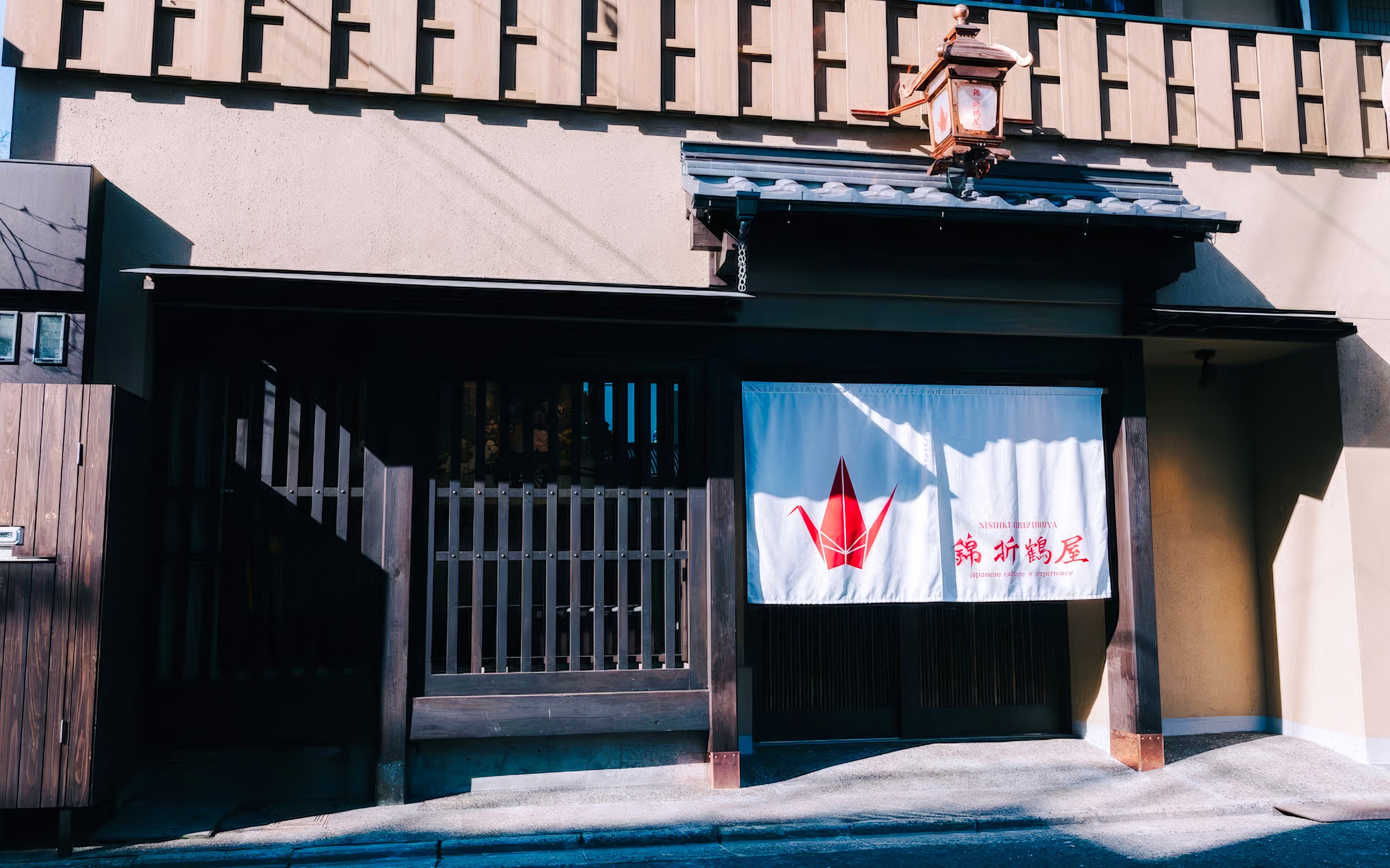 Traditional Japanese house entrance with tea ceremony venue curtain.