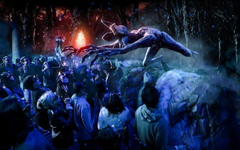 Guests interacting with a Demogorgon at Stranger Things experience, Netflix House, Philadelphia.