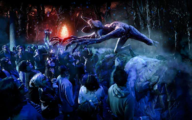 Guests interacting with a Demogorgon at Stranger Things experience, Netflix House, Philadelphia.